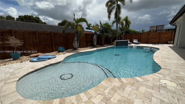 view of pool featuring a patio