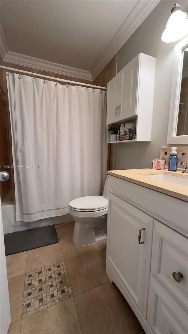 full bathroom featuring shower / bathtub combination with curtain, tile patterned floors, crown molding, toilet, and vanity