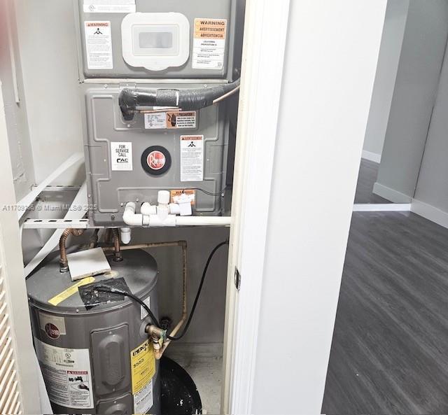 utility room featuring electric water heater