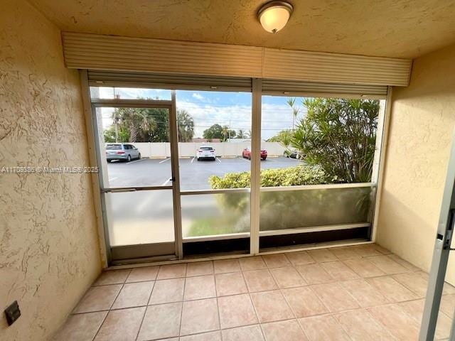 unfurnished sunroom featuring a healthy amount of sunlight