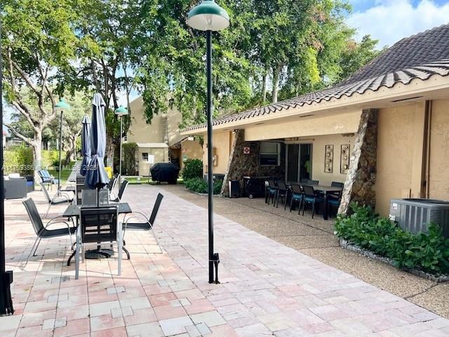 view of patio / terrace with central air condition unit