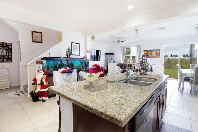 kitchen with stainless steel dishwasher, a kitchen island with sink, ornamental molding, and sink