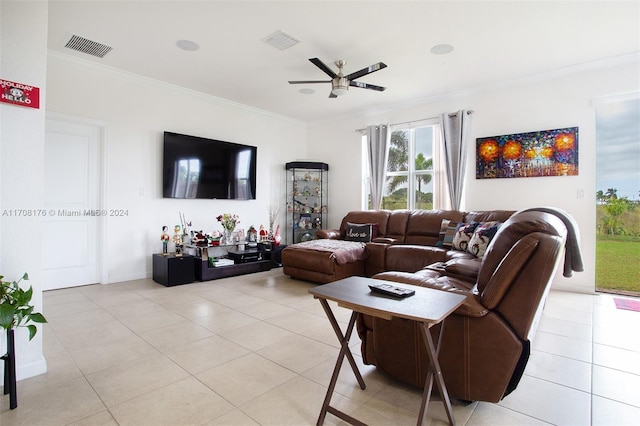 living room featuring ceiling fan, light tile patterned floors, and ornamental molding