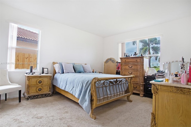 bedroom with light colored carpet