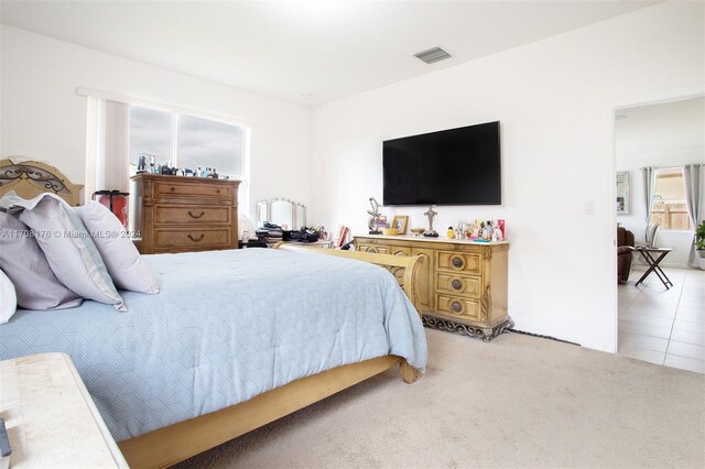 bedroom with light carpet