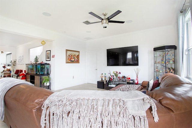 bedroom with ceiling fan and crown molding