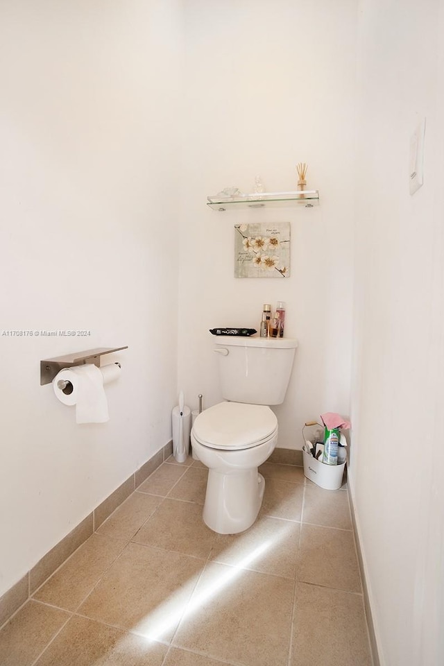 bathroom featuring tile patterned flooring and toilet