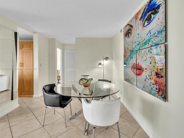 dining room with light tile patterned flooring