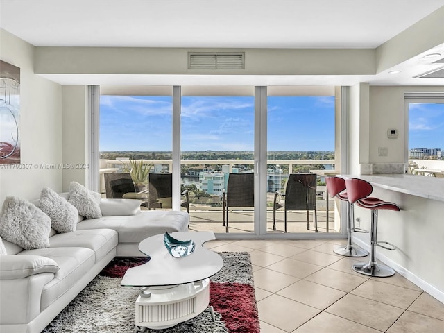 living room with tile patterned floors