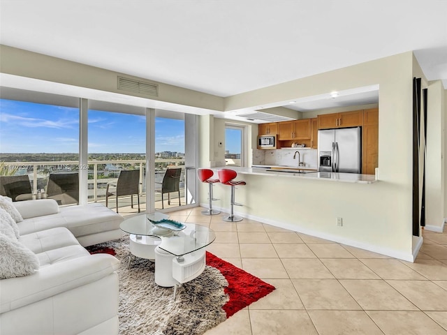 living room with light tile patterned flooring