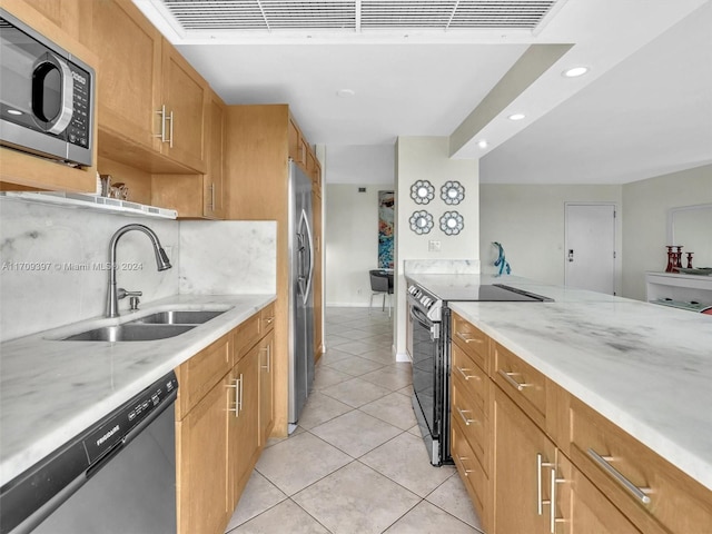 kitchen featuring light tile patterned floors, backsplash, stainless steel appliances, and sink