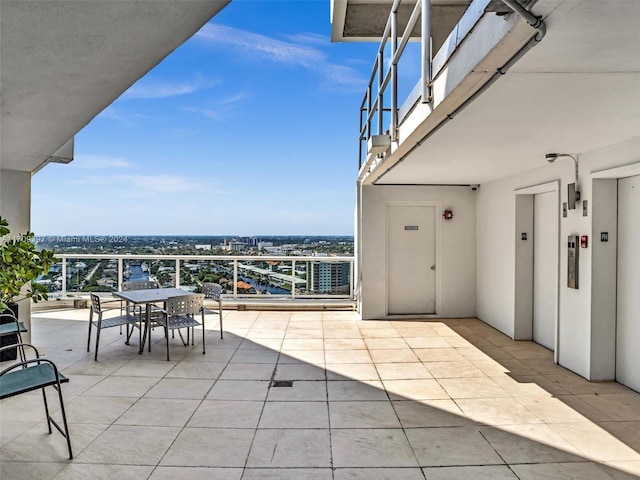 view of patio / terrace with a balcony and elevator