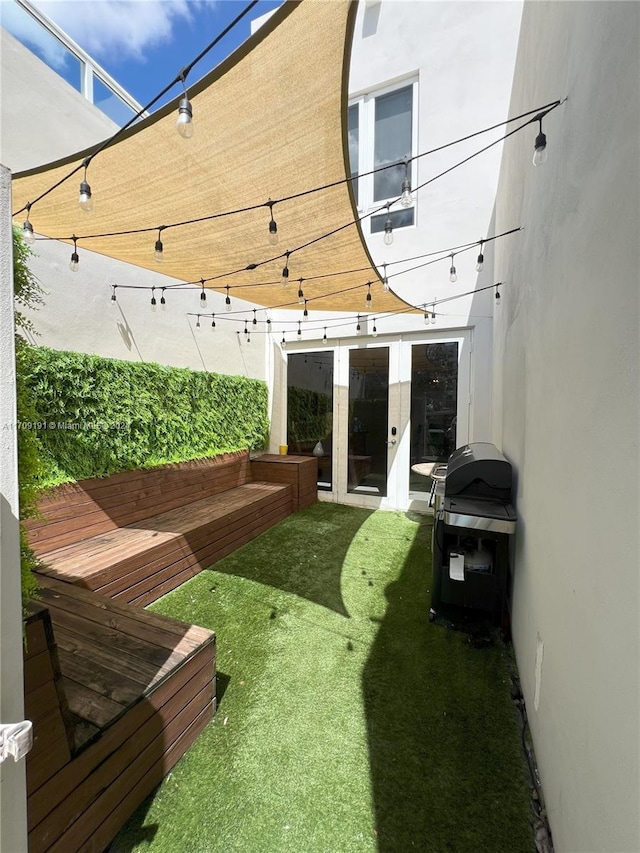 view of yard with french doors