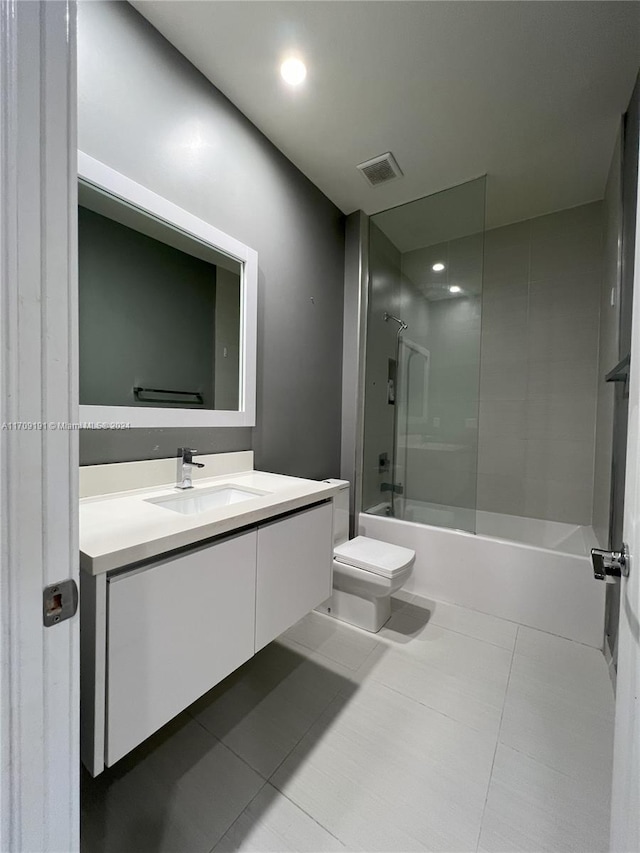 full bathroom with toilet, shower / bathing tub combination, vanity, and tile patterned floors