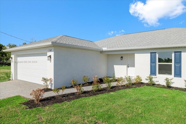 exterior space with a front lawn and a garage