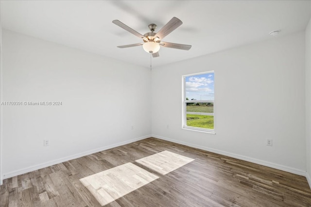 spare room featuring ceiling fan and light hardwood / wood-style floors