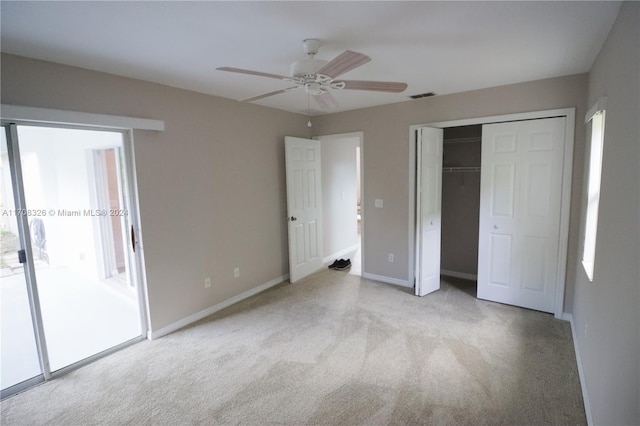 unfurnished bedroom featuring ceiling fan, access to exterior, and light carpet