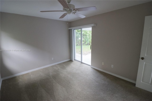 empty room featuring carpet flooring and ceiling fan