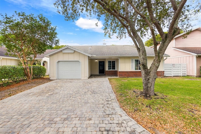 ranch-style house with a front lawn and a garage