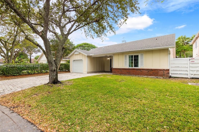 ranch-style house with a front lawn and a garage