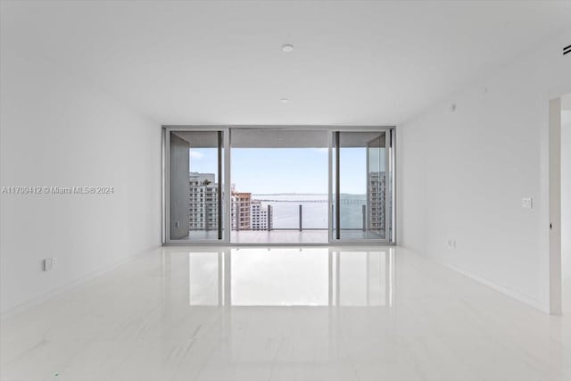 empty room featuring floor to ceiling windows