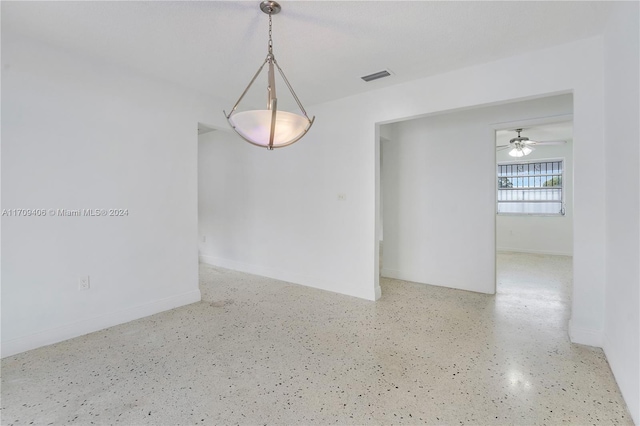 unfurnished room with ceiling fan