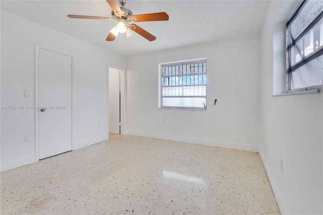 empty room featuring ceiling fan