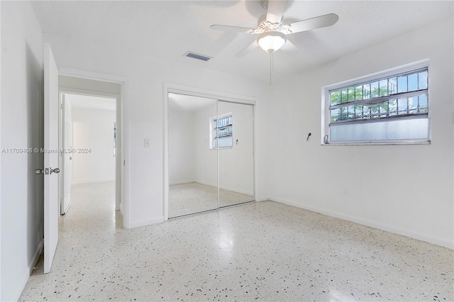 unfurnished bedroom with a closet and ceiling fan