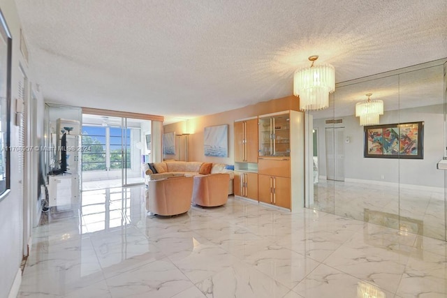 living room with a chandelier and a textured ceiling