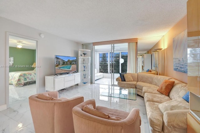 living room featuring a textured ceiling and a wealth of natural light