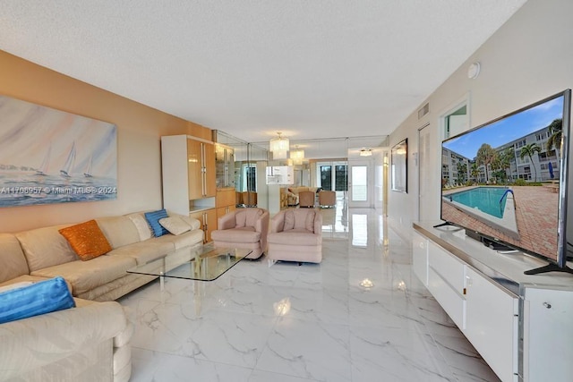 unfurnished living room featuring a textured ceiling