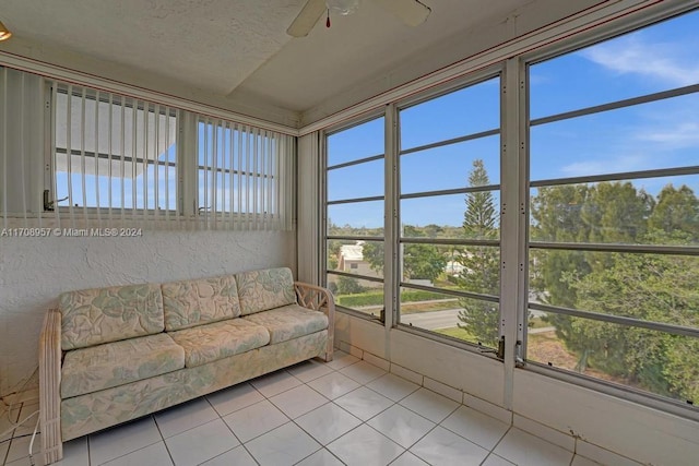 unfurnished sunroom with ceiling fan and a healthy amount of sunlight