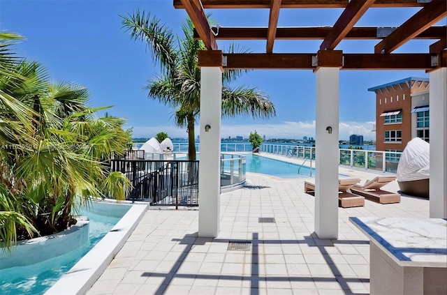 view of swimming pool with a pergola and a patio