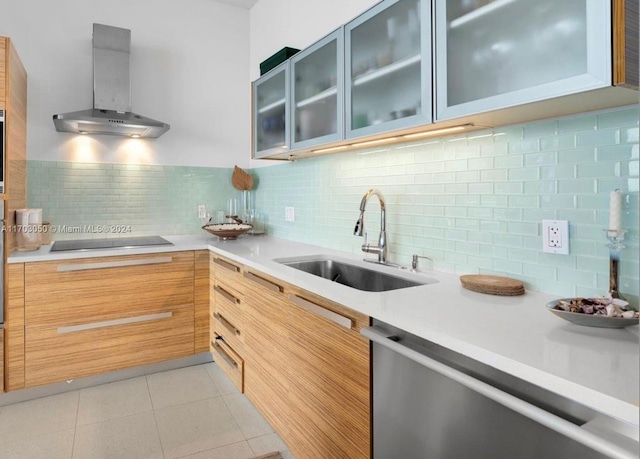 2020 N Bayshore Dr Unit 1008, Miami, FL 33137 - kitchen with wall chimney range hood, stainless steel dishwasher, light countertops, black electric cooktop, and glass insert cabinets