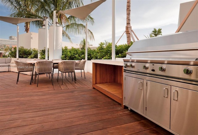 wooden deck with an outdoor living space