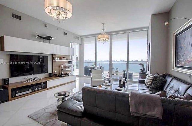 2020 N Bayshore Dr Unit 1008, Miami, FL 33137 - living room featuring healthy amount of natural light, expansive windows, a water view, a chandelier, and tile patterned floors