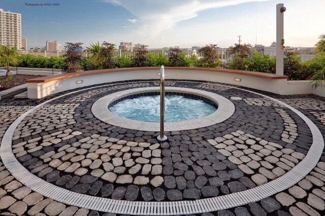 view of pool with a community hot tub