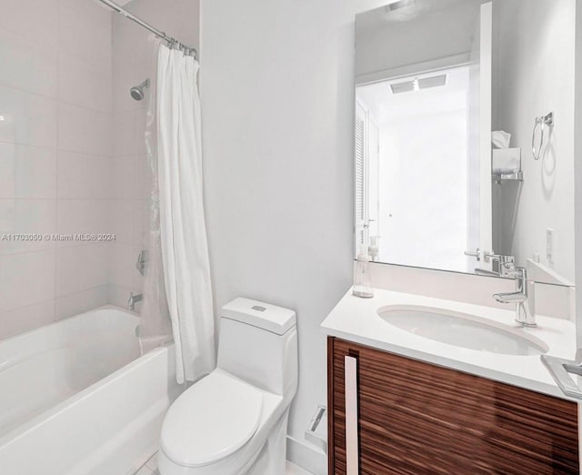 full bathroom featuring vanity, toilet, and shower / tub combo with curtain