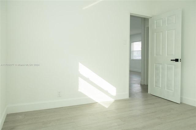 unfurnished room featuring light hardwood / wood-style flooring