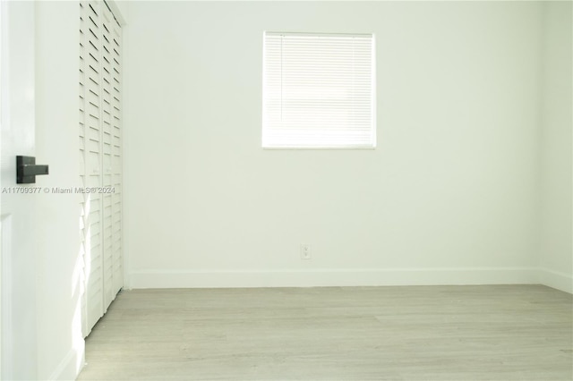 unfurnished room featuring light hardwood / wood-style floors