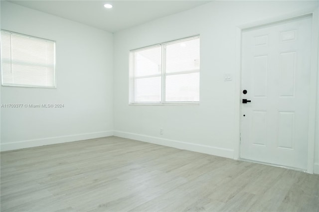 spare room featuring light wood-type flooring