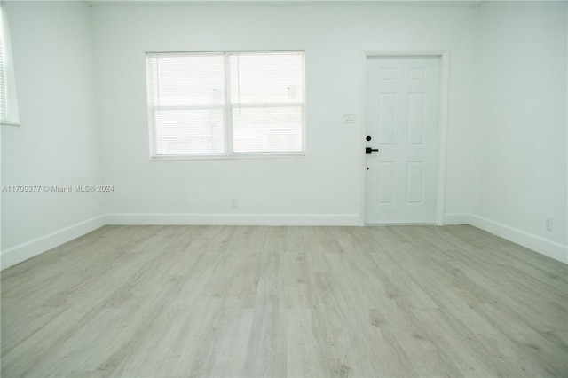 empty room with light wood-type flooring