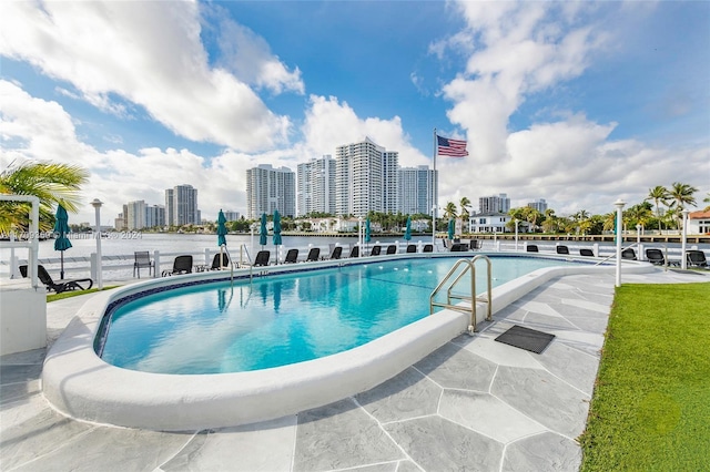 view of swimming pool with a patio