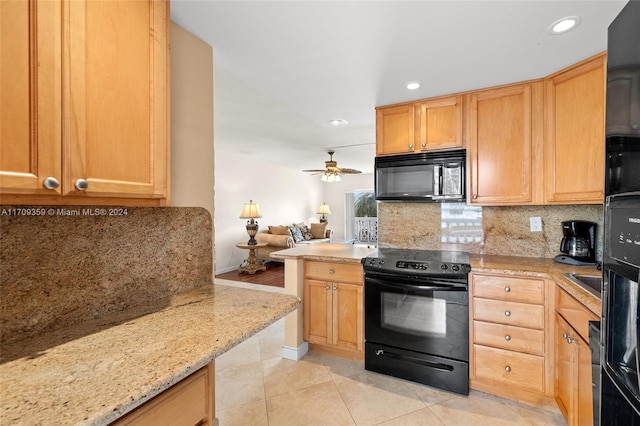 kitchen featuring decorative backsplash, light stone countertops, ceiling fan, black appliances, and light tile patterned floors