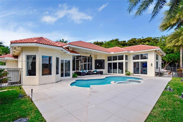 exterior space featuring an outdoor living space, ceiling fan, and a patio