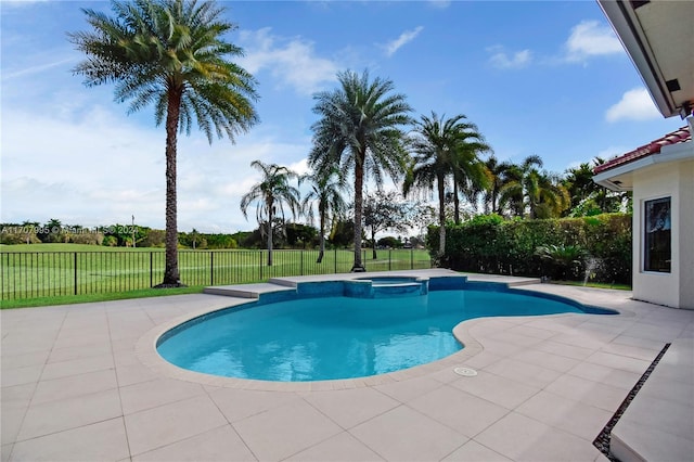 view of swimming pool featuring an in ground hot tub and a patio area