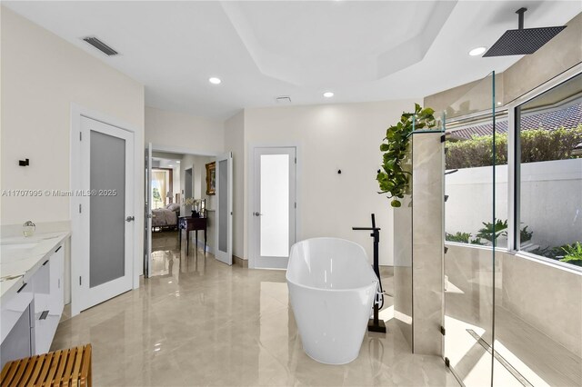 2445 Provence Cir, Weston, FL 33327 - bathroom featuring a walk in shower, a freestanding bath, vanity, recessed lighting, and visible vents