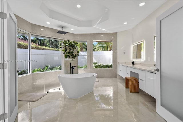 2445 Provence Cir, Weston, FL 33327 - full bathroom featuring plenty of natural light, marble finish floor, a freestanding bath, and vanity