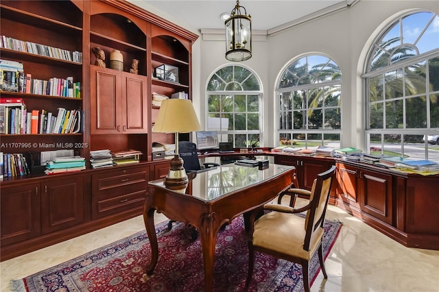 home office with an inviting chandelier