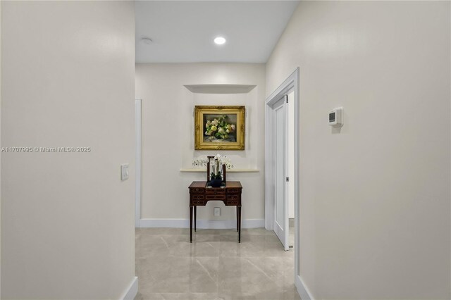 bathroom featuring vanity, toilet, and tile walls